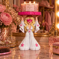 3D-printed Dolly candle holder with a standard 3-wick candle on a pink DOLLY platform