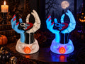 Regular and glow-in-the-dark Jack and Sally candle holders with split heart