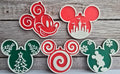 Five 3D-printed mouse-ear Christmas ornaments in red, green, and white: classic Mickey, castle, Christmas trees, peppermint swirl, and snowflakes