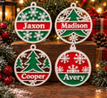 Four personalized red, green, and white Christmas ornaments with the names Jaxon, Madison, Cooper, and Avery