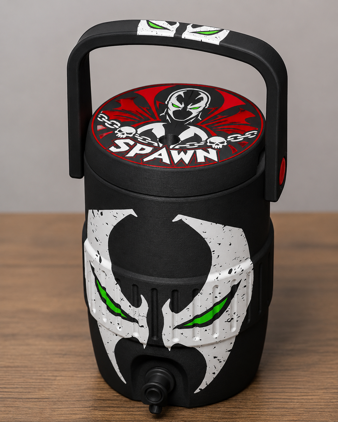 Spawn coozie with iconic mask design and glowing green eyes